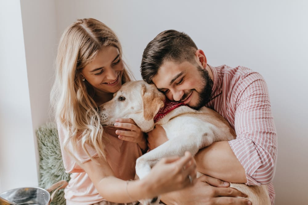 "Family hugging their pet with peace of mind from pet insurance protection.
